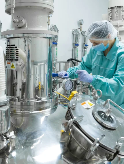 pharmaceutical-factory-woman-worker-protective-clothing-operating-production-line-sterile-environment.jpg